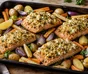 Salmone al forno con crosta dorata di caprino e noci, patate e ortaggi da radice arrostiti